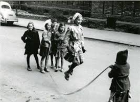 a girl skipping a rope held by two others